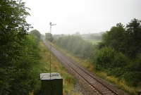 A few looking north to Dublin from the road overbridge at Camolin. The station did not a have a signal cabin, the siding serving the goods shed was operated by a ground lever frame. The station closed in March 1964.