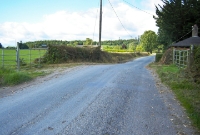 Like the level crossing on the N72 at Cappagh Station, the hump where the line crossed road is still evident at this location.