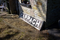 The pre-1925 Great Southern &#38; Western Railway name board on the platform at Cappagh Station.