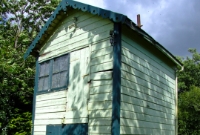 Closer view of this GSWR wooden built signal cabin at Cappoquin Station. Although the steps have been removed the structure remains largely intact since closure in 1967.