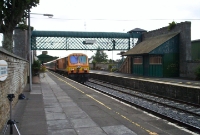 Framed by the Great Southern &#38; Western&#39;s Victorian station buildings and canopy at Carlow is 201 Class loco No.212, seen propelling a northbound Waterford to Dublin pushpull train.