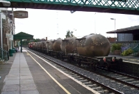 An 071 and a 141 Class locomotive head north through Carlow with a cement train from Waterford. These vintage CIE cement &#39;bubbles&#39; seen here have since been scrapped.