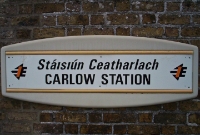 The plastic IE station name board at Carlow, a type of which is now obsolete. Carlow is the county town of the same name.