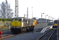 The goods facilities on the down side of Carlow Station are no longer served by the trains, although a single siding remains for civil engineering work. 071 Class loco No.075 is seen stabled on this siding with a loaded ballast train.