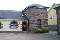 The stone built base of the water tower is also clearly evident at Carrickmacross. Although the tank is missing the structure has since been converted into another private residence.