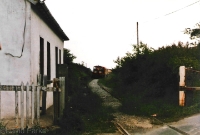 In June 1985, 141 Class loco No.159 approaches Carrolls Cross with CIE&#39;s annual weed spraying train en route from Waterford to Ballinacourty. On the left is the station building/gate keepers house. ©David Parks