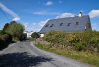 Carrolls Cross, viewed from the road on the approach to the former level crossing. The station was located just off the main N25 road to Waterford.