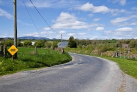 Surprisingly the sign warning road users of the gated level crossing at Carrolls Cross Station remains in situ, despite that the line as well as the crossing gates has been gone for more than 10 years. The station itself can be seen in the background.