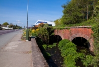 Adjacent to the site of Castle Bernard Station is this small double arched bridge across the Bridewell River. The adjacent N71 road on the left has been widened considerably since closure of the line in 1961.