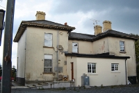 This is the railway side of the former Castleblayney Station, where the single platform was once sited. Very little remains of the railway station apart from the main building, the site having been heavily built over with houses.