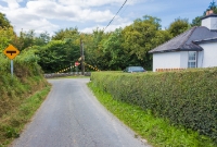Another view of the approach to the former Ballyrafton level crossing, north of Castlecomer Jct. The road junction ahead leads down to the N78. Interestingly the stone wall retains its 1950s red/white warning markings, which would have been associated with the level crossing also.