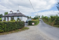 The third level crossing to be found on the branch line to Castlecomer, north of the junction, is the former &#39;Ballyrafton&#39; crossing, located just off the N78 road. The standard 1920s built gate keepers house survives, and railway would have crossed from left to right through the present driveway of the house.