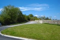 Looking north towards the coal mines at Castlecomer from the same position as the previous photo. The gravel road marks the formation of the former trackbed.