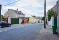 The extension of the line to Deepark Colliery crossed Barrack Street within Castlecomer town. The former line passed through gated entrance on the left.