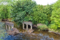 The concrete piers which carried the railway across the Dinin River are still in situ just south of Dysart crossing, visible from the adjacent N78 road.