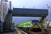 Nowadays diesel railcars dominate the Sligo and Maynooth services. 29000 Class railcar No.29421 is framed by the 1990s spartan style footbridge at Castleknock, with a service for the Docklands in Dublin City.