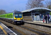 29000 Class railcar No.29120 coasts into Castleknock Station with a service to Dublin Connolly. The somewhat modern rusted looking station building is typical of the type found at suburban stations on the line to Maynooth.