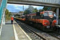Seen passing through the suburban station at Castleknock is an afternoon Dublin to Sligo train hauled by 071 Class loco No.073, consisting of Mk2 coaching stock. This type of train has since been consigned to history on Irish Rail, although loco No.073 still remains much in service.