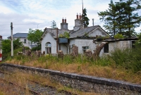 A former railway cottage which is located on the overgrown &#39;Down&#39; platform at Castletown Station. The building is currently semi-derelict.