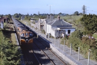 On 17th September 1989, 071 Class loco No.085 runs through the former station at Castletown with a GAA special bound for Dublin. In this view looking west towards Athlone can be seen the main station buildings, by then in private ownship. ©Colm O&#39;Callaghan