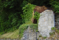 The stone built structure here which now supports an oil tank was in fact the base of a footbridge which once spanned the Great Northern&#39;s line and goods yard at the north end of Cavan.