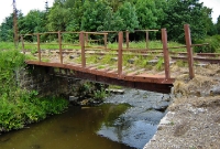 This is the small iron bridge which carries the disused line across the Mullaghanoe River, viewed following the recent vegetation clearance.