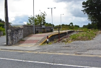 A couple of years later the former platform at Charlestown has been tidied up by the local community. A new name board and platform lamps have been added and the platform resurfaced. The station buildings were demolished in the mid 1980s.