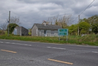 Like many other stations on the Schull &#38; Skibbereen Tramway, a simple single platform and station building was provided adjacent to the roadway, visible to the left.