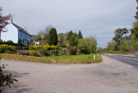 This was the western end of Clonakilty Jct Station, looking towards Bantry, where the one time station building, signal cabin and footbridge were sited. Today only the station masters house visible to the left remains.