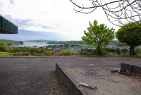 The scenic view from what would have been the signal cabin at Clonakilty Station, now long since demolished. In the background is the town and Clonakilty Harbour.