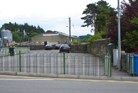 A view looking east towards Dundalk at the former station level crossing at Clones. The stone wall marks the boundary of the former trackbed. &#39;Clones East&#39; signal cabin was once sited here.