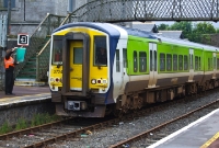 The signalman at Clonmel Station gives the all clear to the driver of 2700 Class No.2724, seen preparing to leave Clonmel with an afternoon Limerick to Waterford service.