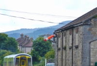 No.2715 is seen on the rear of this 2700 Class railcar set heading away from Clonmel with its service to Waterford. The ground disc signal guards the entrance into the adjacent siding, once used for loading a bagged cement and fertlizer, as well as timber until the end of the 1990s. Note the down starting signal mounted to the former goods shed.