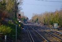 Clonsilla became a junction in 1862 with the construction of the Dublin &#38; Meath Railway from Navan, latterly operated by the MGWR. Passenger services to Navan ceased in 1947, and the line eventually closed in 1963. The turnback siding seen in the background now forms part of the re-opened section to Dunboyne.