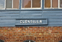 The ancient Midland Great Western wooden name board mounted on Clonsilla signal cabin, probably pre-1925 origin.