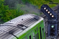 A 29000 Class railcar gets the green light as it departs away from Clonsilla with a service to the Docklands. The white lights above the main signal aspect are known as &#39;feathers&#39; which indicate the direction of the points set for the train.