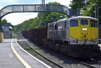 Taking the curve through Clonsilla Station is the 071 Class loco leader, No.071, seen heading the Waterford to Sligo empty timber train.
