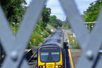 Seen through the cast iron lattice footbridge at Clonsilla is 29000 Class 29115, arriving with a commuter service to Dublin.