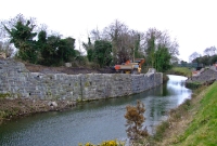 Just beyond the junction are the stone bridge abutments which once carried the 1862 built line from Clonsilla to Navan over the Royal Canal After closure in 1963, the cast iron bridge remained in situ until 1989.