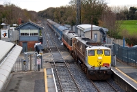 Substituting steam traction on the RPSI&#39;s &#39;Santa Special&#39; is 071 Class loco No.083, seen passing through Clonsilla Station complete with headboard as it heads towards Maynooth.