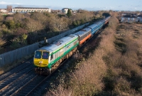 On this occasion, 201 motive is employed on the RPSI &#39;Santa Special&#39; with &#39;Intercity&#39; liveried loco No.215, seen approaching Porterstown level crossing just east of Clonsilla with a working to Maynooth.