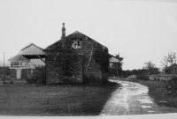 The goods shed and signal cabin at Colbinstown Station, some years after closure. In the background is the now demolished cattle loading bank.