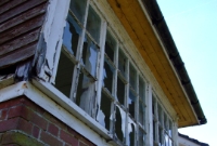 The brick base of the signal cabin at Colbinstown probably dates from the line&#39;s opening in 1885. Some of the original rear window panes survive, seen here.