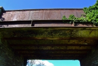 The fine road overbridge at the south end of Colbinstown Station remains intact. This substantial structure is typical of the type built on the Tullow branch.