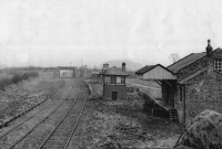 Colbinstown Station from the &#39;up&#39; signal post looking south towards Tullow in the late 1950s, with goods shed complete with wooden canopy, signal cabin, and in the distance the road overbridge.
