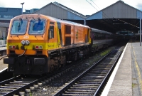 201 Class loco No.225 is seen in its original 1990s orange livery at platform 3 at Connolly Station while on &#39;Enterprise&#39; duties. Due to a number of GAA specials operated this day, the Enterprise had to vacate its usual platform.