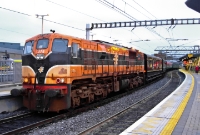 071 Class loco No.076 in its orange &#38; black livery is seen in charge of a rake of preserved RPSI coaches at Connolly Station. The Victorian carriage behind the loco is No.1142, built in 1921 by the Great Southern &#38; Western Railway at Inchicore Works, and is a &#39;1st Class Corridor&#39;.