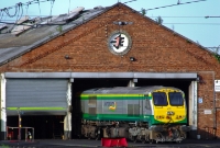 A clean looking 201 Class loco, No.227, is seen stabled outside Connolly locomotive shed. The red flag across one of the tracks indicates the line is blocked due to a fault with the shutter across shed entrance.