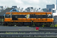 A side profile view of 141 Class locomotive No.144, seen stabled adjacent to Connolly loco shed. The city scape horizon behind the loco would have looked very different to when 144 entered service with CIE in November 1962.