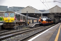 201 Class loco No.233 gets a morning &#39;Enterprise&#39; service to Belfast underway, while B141+B142 await departure time to Longford. The CIE &#39;black &#38; tan&#39; livery had been since on Irish railways since at least 1977.